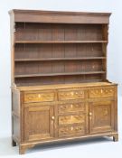 A GEORGE III OAK DRESSER AND RACK