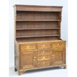 A GEORGE III OAK DRESSER AND RACK