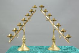 A PAIR OF 19TH CENTURY BRASS SEVEN-LIGHT ECCLESIASTICAL CANDELABRA