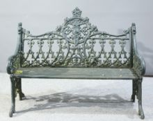 A GREEN PAINTED CAST IRON GARDEN BENCH