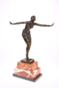 AN ART DECO STYLE BRONZE FIGURE OF A DANCER