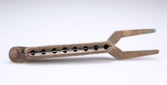 A BRONZE DUAL-SIZE BALL CASTING TOOL