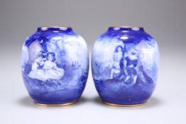 A PAIR OF ROYAL DOULTON BLUE CHILDREN SERIES VASES