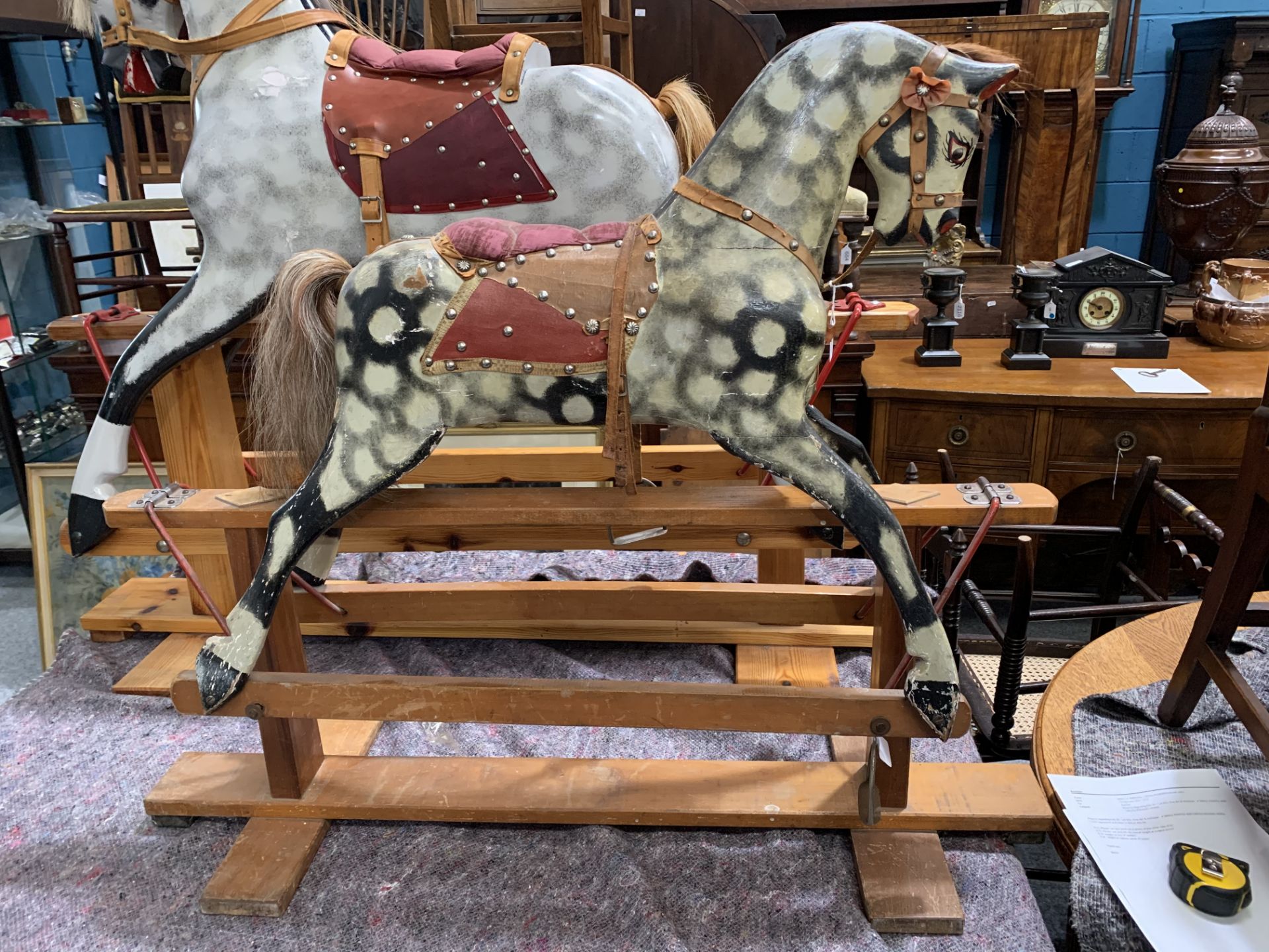 A SMALL PAINTED AND CARVED ROCKING HORSE - Bild 2 aus 9