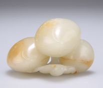 A CHINESE CELADON JADE FRUIT CARVING