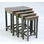 A SET OF FOUR CHINOISERIE LACQUER NESTING TABLES