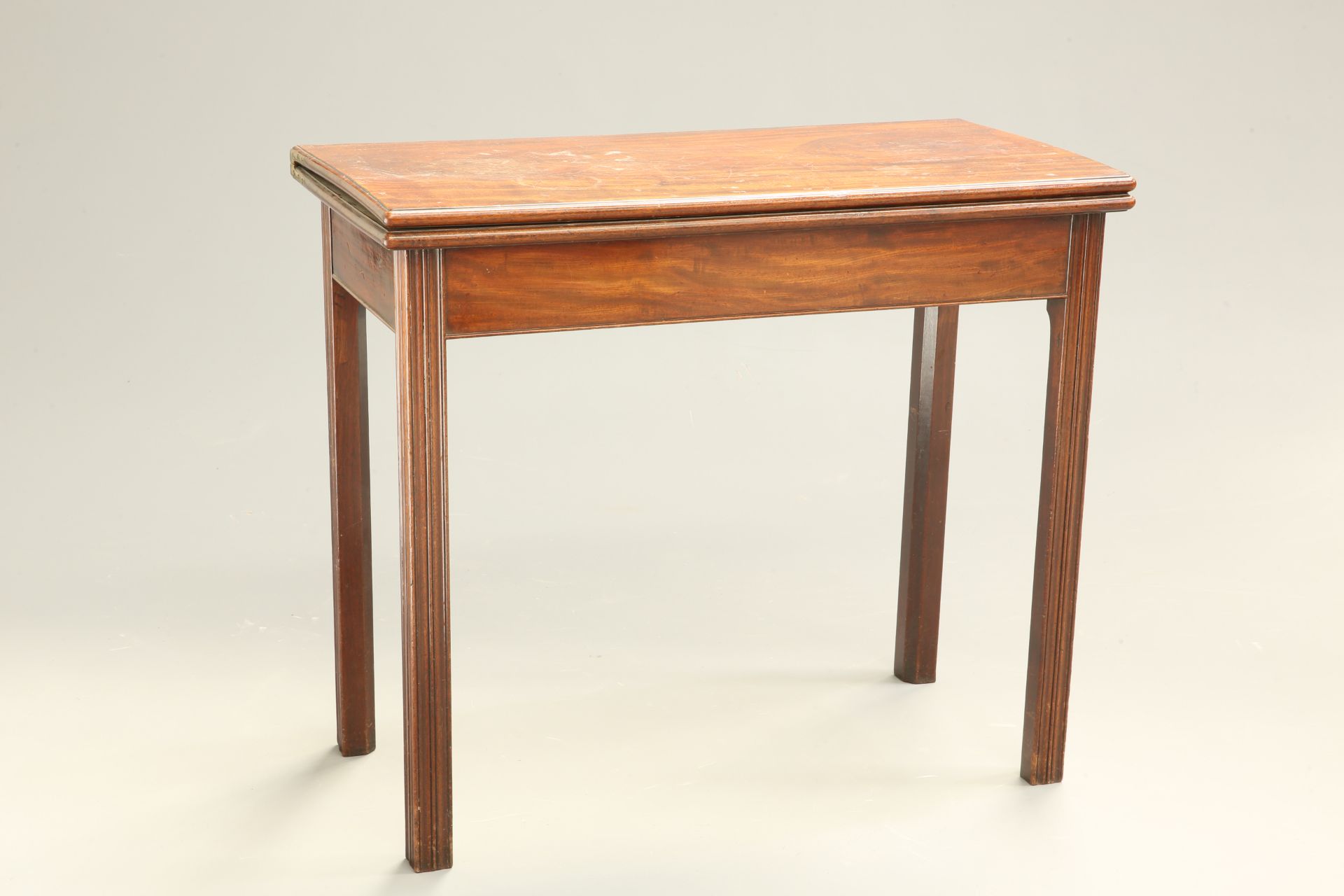 A GEORGE III MAHOGANY FOLDOVER CARD TABLE