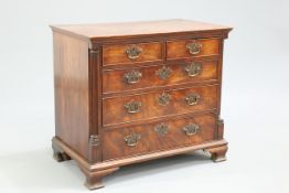 A GEORGE III RED WALNUT CHEST OF DRAWERS