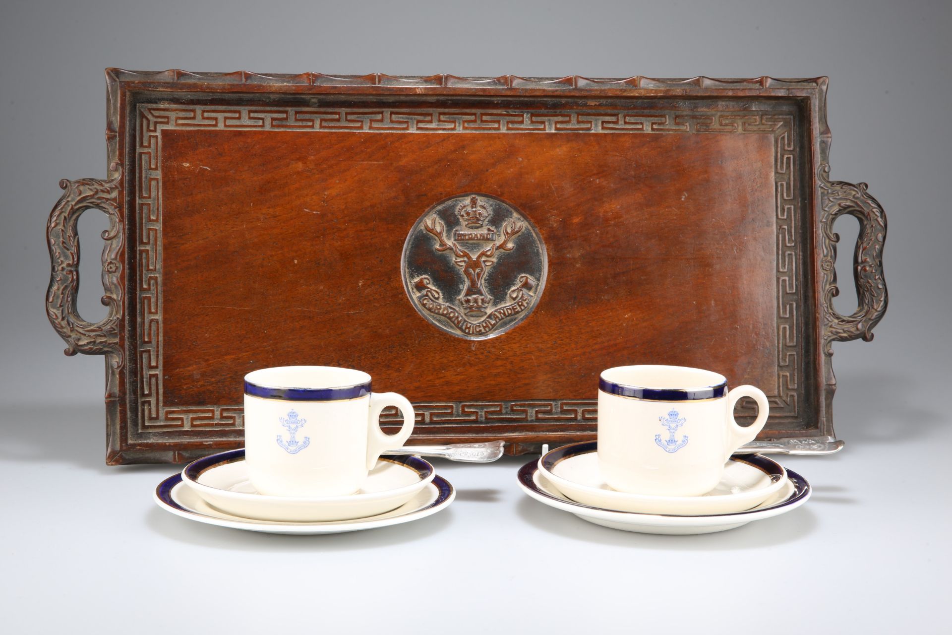 A FINELY CARVED RECTANGULAR WOODEN SERVING TRAY