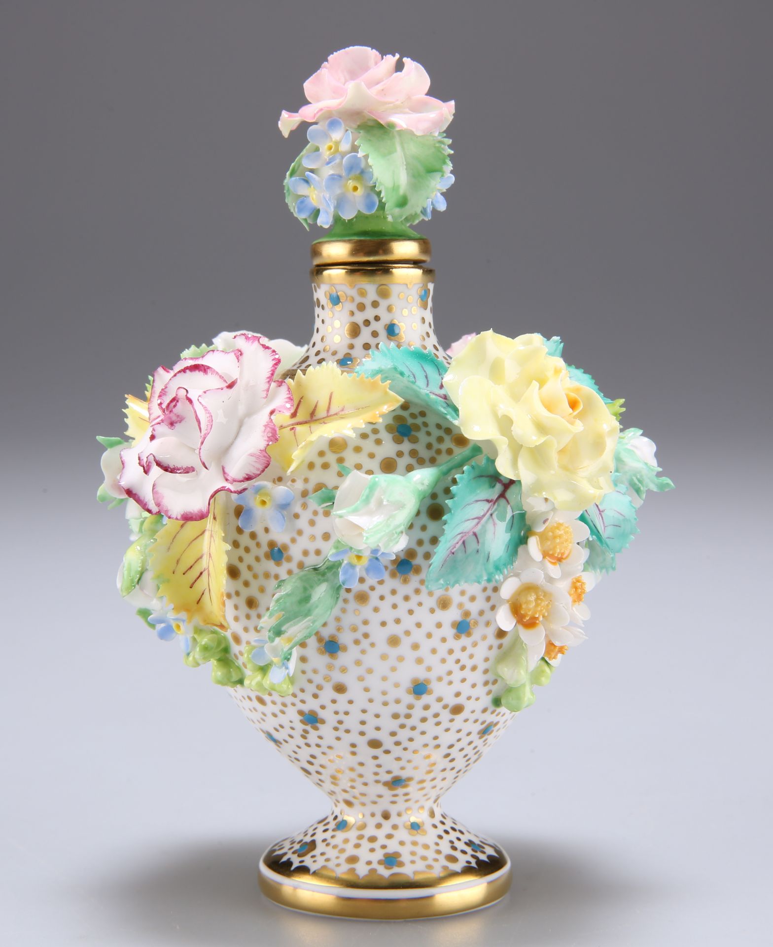 A LYNTON PORCELAIN FLORAL ENCRUSTED SCENT BOTTLE