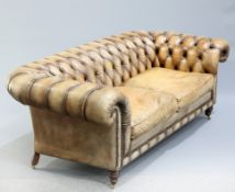 A VICTORIAN STYLE BROWN LEATHER CHESTERFIELD SETTE