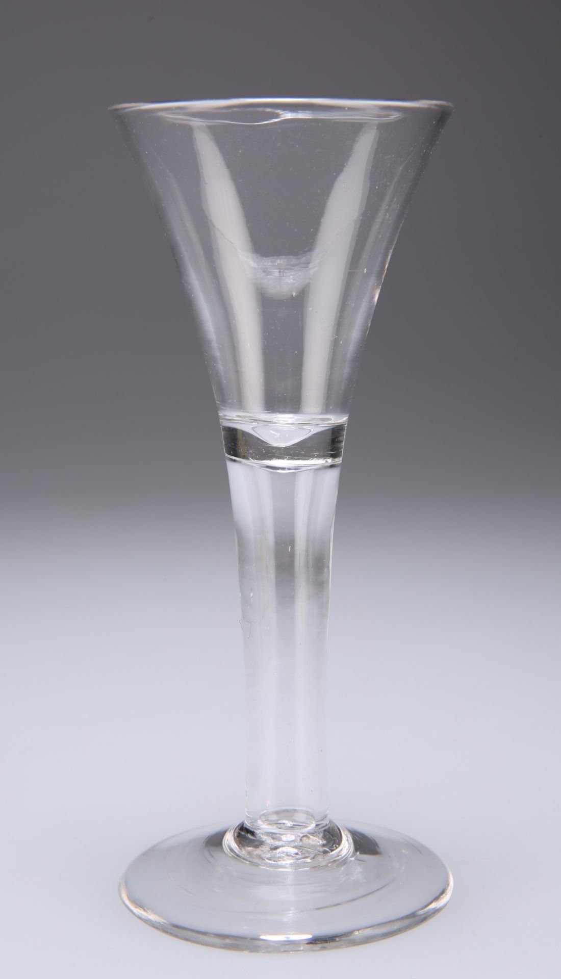 AN EXCISE GLASS