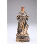 A CARVED AND PAINTED FIGURE OF A SAINT