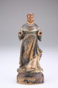 A CARVED AND PAINTED FIGURE OF A SAINT