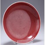 A CHINESE OX-BLOOD GLAZED PORCELAIN DISH