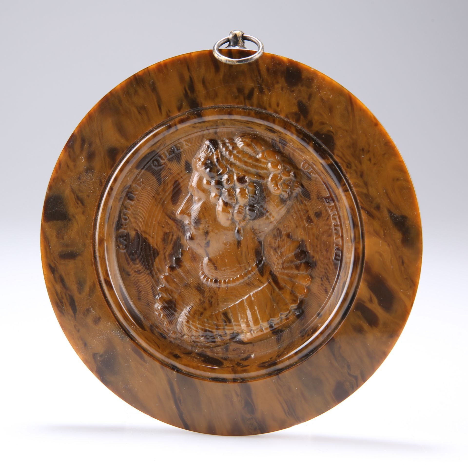 A PRESSED TORTOISESHELL ROUNDEL