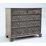 A GEORGE III OAK CHEST OF DRAWERS