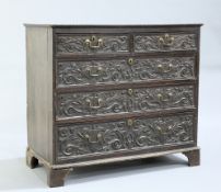 A GEORGE III OAK CHEST OF DRAWERS