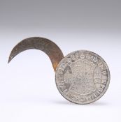 A 1943 HALF-CROWN CONCEALING A SCYTHE-LIKE BLADE