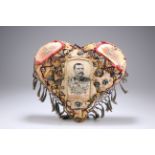 A BOER WAR PERIOD HEART-SHAPED 'FORGET ME NOT' CUSHION