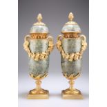 A PAIR OF CONTINENTAL GILT-METAL MOUNTED SERPENTINE VASES AND COVERS