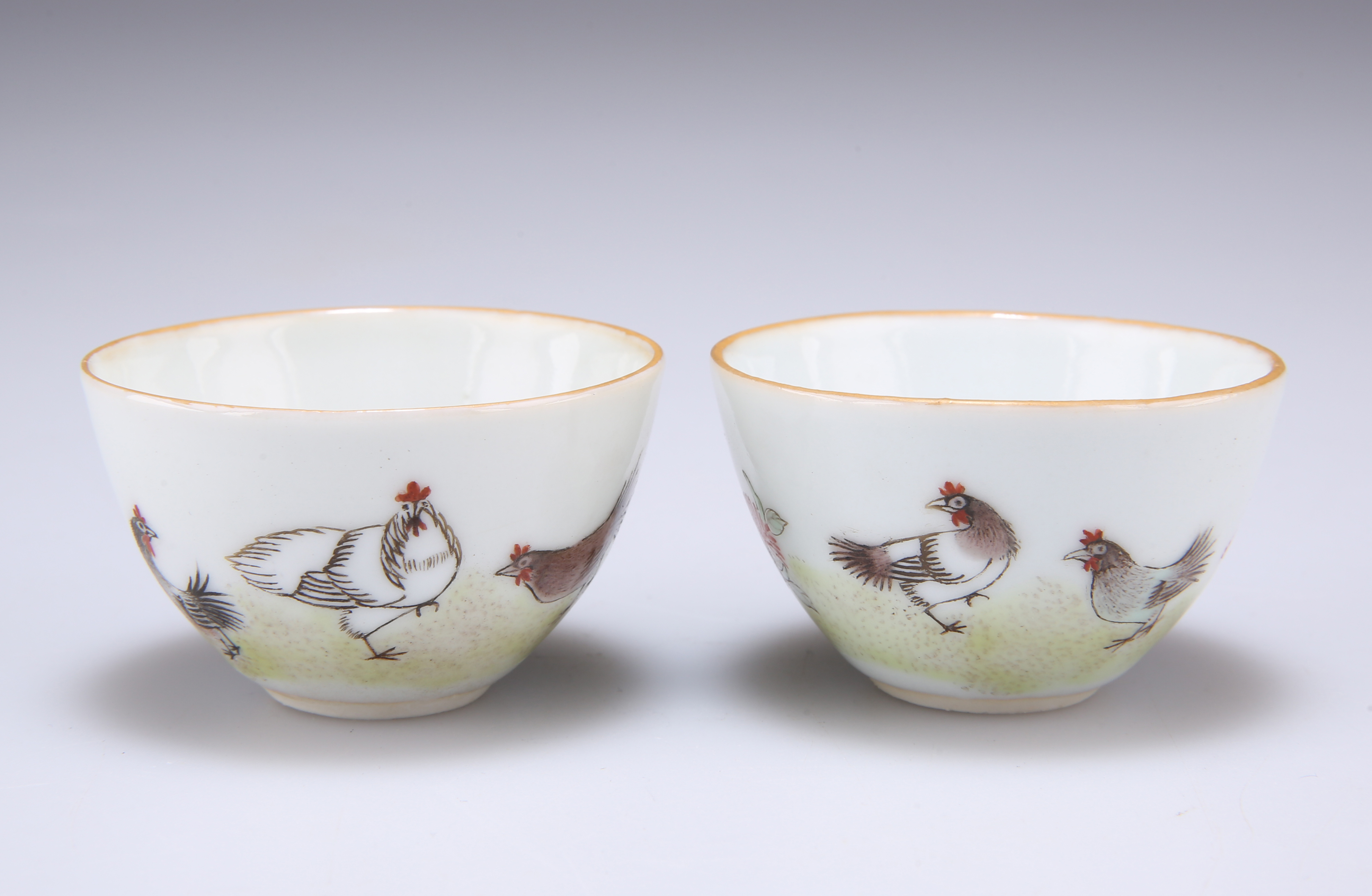 A SMALL PAIR OF CHINESE PORCELAIN CUPS