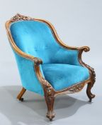 A VICTORIAN WALNUT AND UPHOLSTERED ARMCHAIR