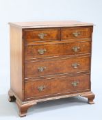 A GEORGE II STYLE BURR YEW CHEST OF DRAWERS