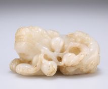 A CHINESE CELADON JADE CARVING OF A LION DOG