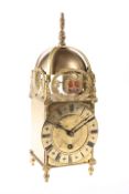 A BRASS FRAMED LANTERN CLOCK