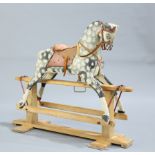 A PAINTED AND CARVED ROCKING HORSE