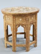 AN INDIAN BONE AND EBONY INLAID HARDWOOD OCCASIONAL TABLE