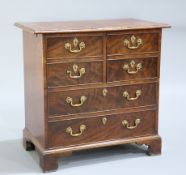 A GEORGE III STYLE MAHOGANY CABINET