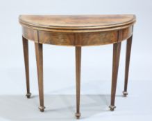 A GEORGE III MAHOGANY FOLD OVER CARD TABLE