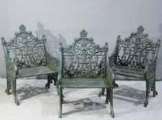 A SET OF THREE GREEN PAINTED CAST IRON GARDEN CHAIRS