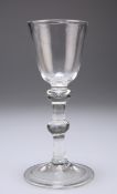 A BALUSTROID WINE GLASS