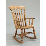 A 19TH CENTURY ELM AND BEECH ROCKING CHAIR