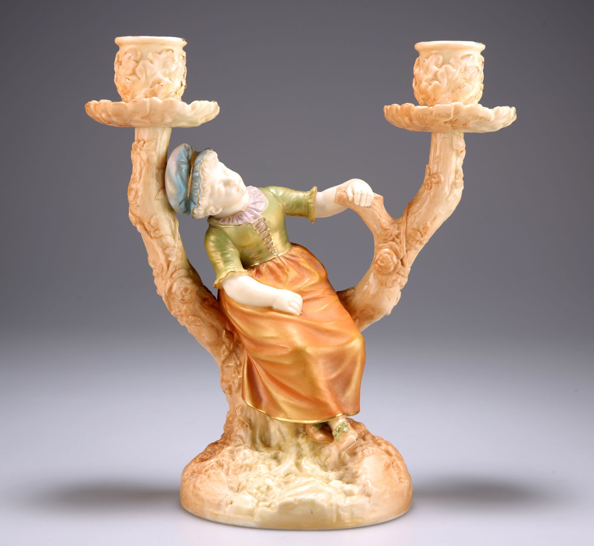 A ROYAL WORCESTER TWO-BRANCH CANDLE HOLDER