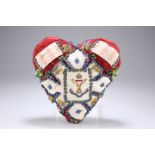 A HEART-SHAPED 'FORGET ME NOT' CUSHION