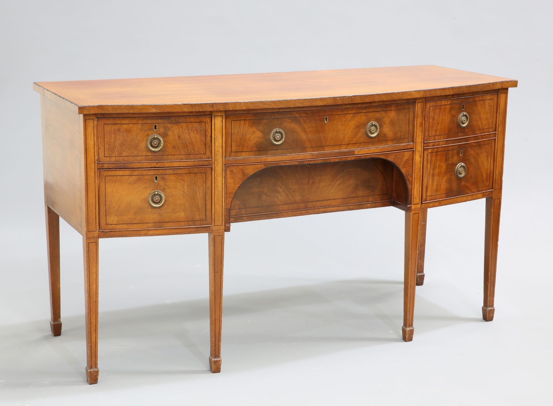 A REGENCY STYLE MAHOGANY BOWFRONTED SIDEBOARD