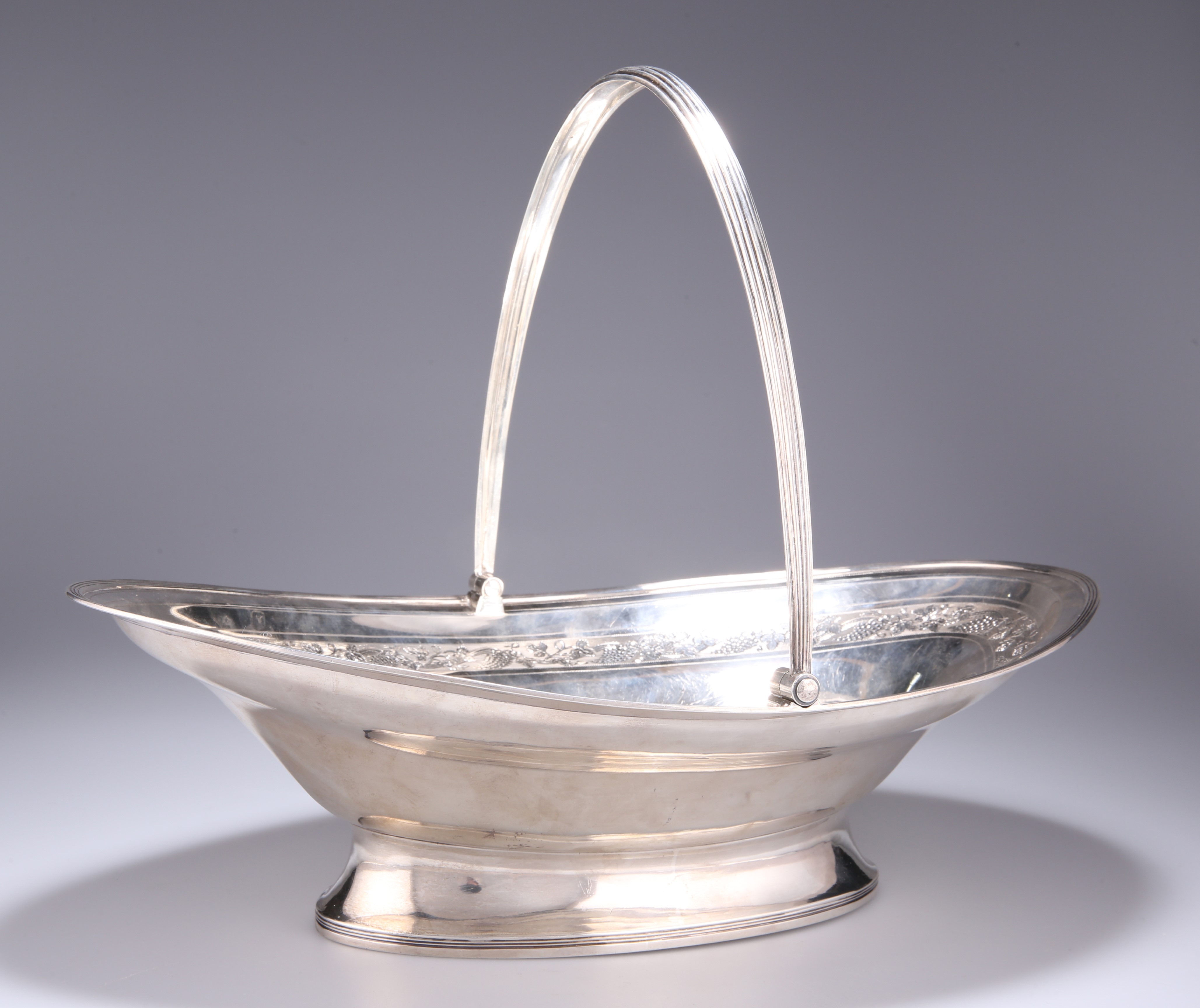 A LARGE GEORGE III SILVER SWING-HANDLE BASKET