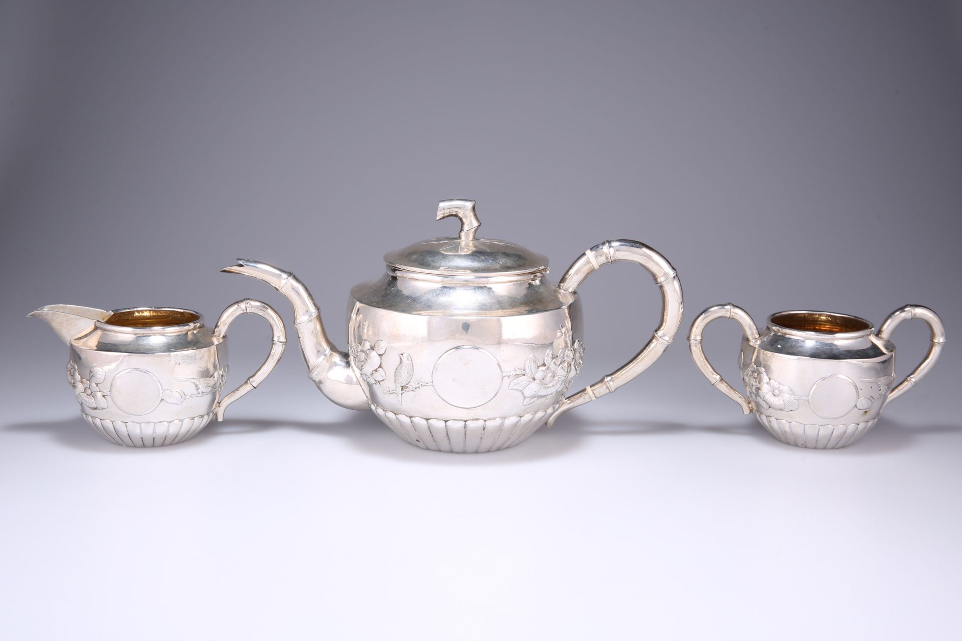 A FINE CHINESE EXPORT SILVER THREE-PIECE TEA SERVICE, EARLY 20TH CENTURY
