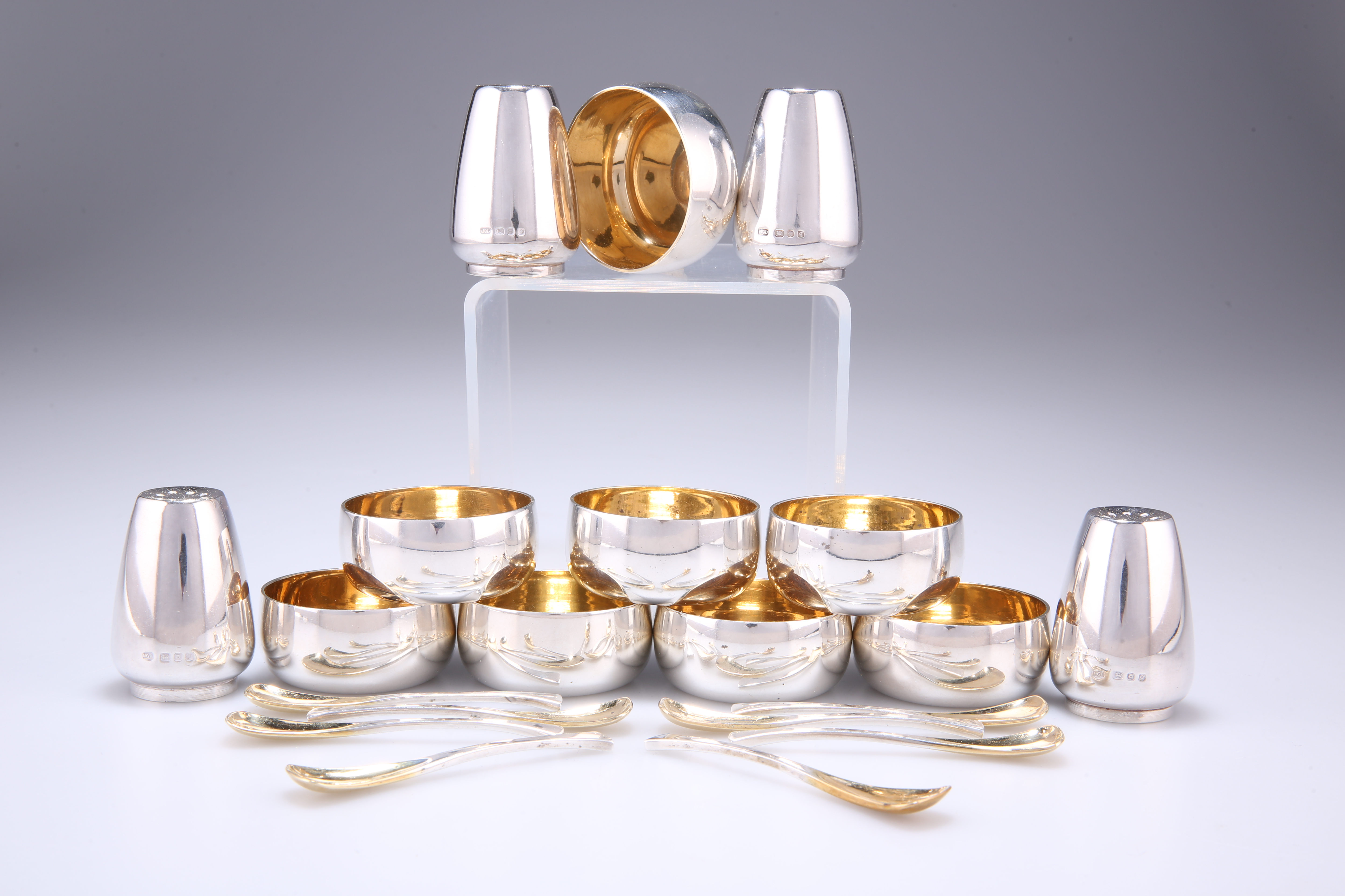 AN ELIZABETH II PARCEL-GILT SILVER CONDIMENT SET