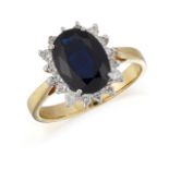 AN 18CT GOLD SAPPHIRE AND DIAMOND CLUSTER RING