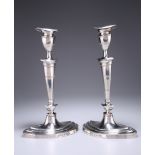 A PAIR OF GEORGE V SILVER CANDLESTICKS