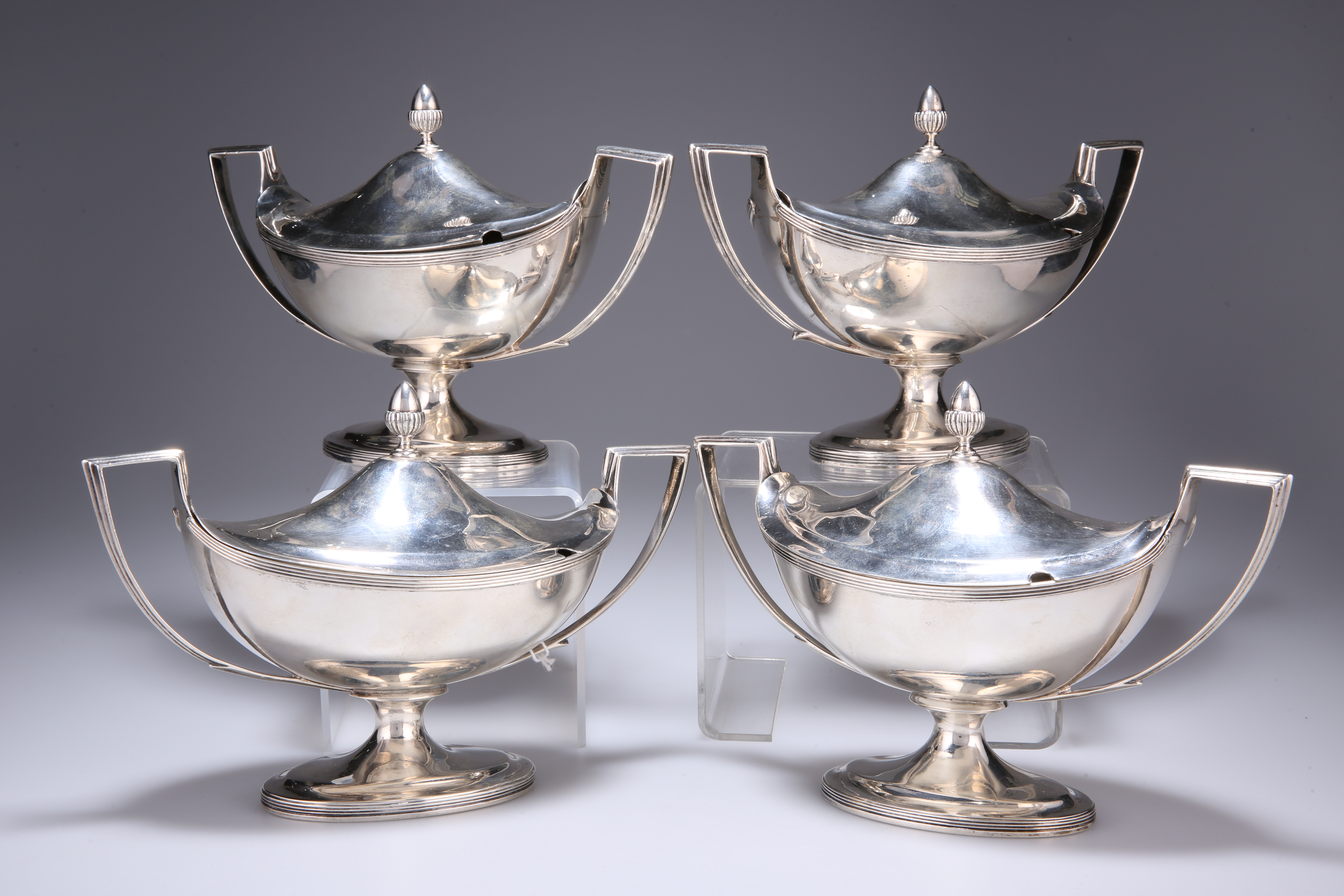 A SET OF FOUR GEORGE III SILVER SAUCE TUREENS AND COVERS