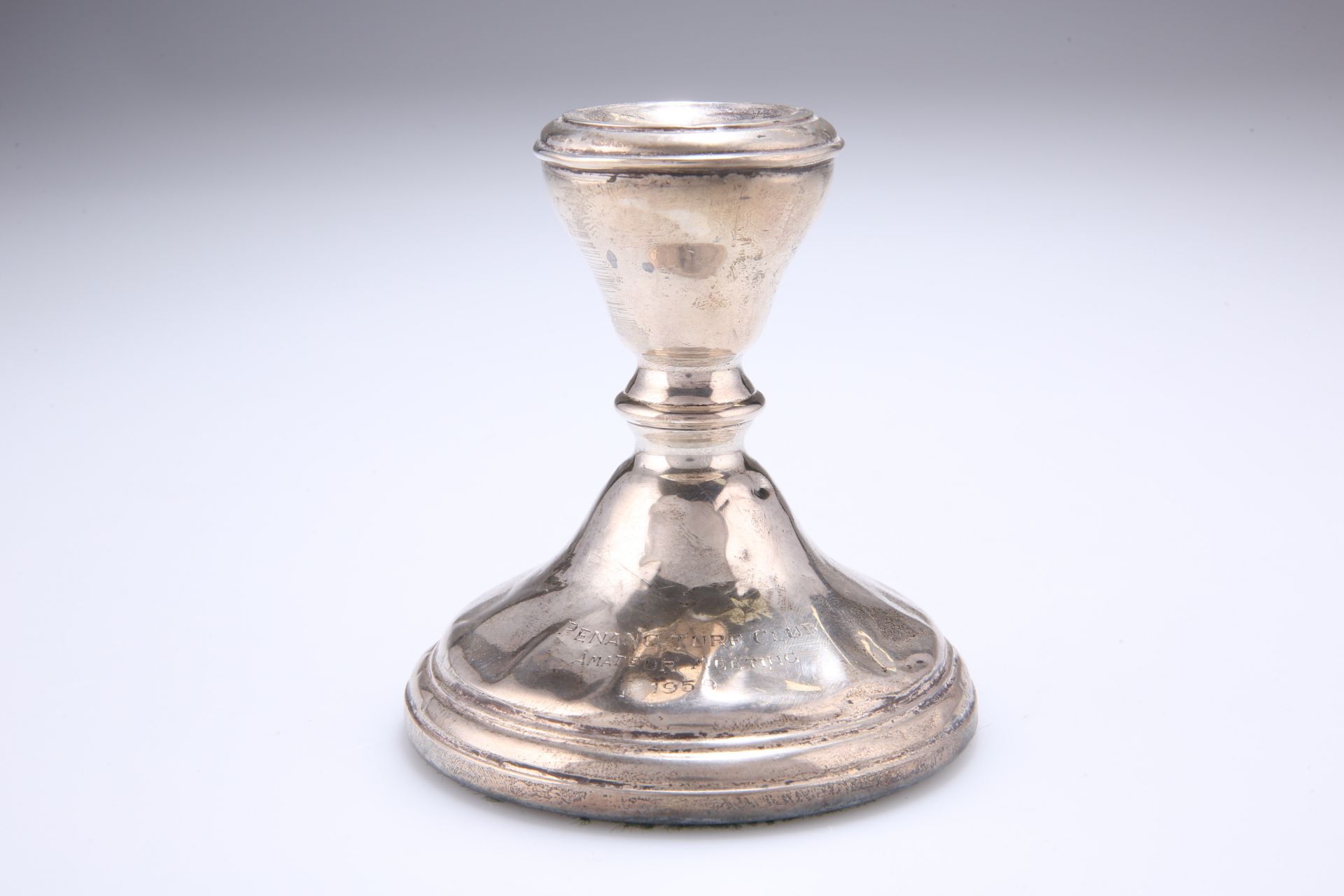 ^ AN ELIZABETH II SILVER CANDLESTICK