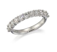 AN 18CT WHITE GOLD DIAMOND HALF HOOP RING