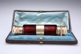 A VICTORIAN SILVER GILT AND CRANBERRY GLASS COMBINED DOUBLE ENDED SCENT BOTTLE AND VINAIGRETTE