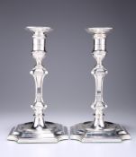 A PAIR OF EDWARDIAN SILVER CANDLESTICKS